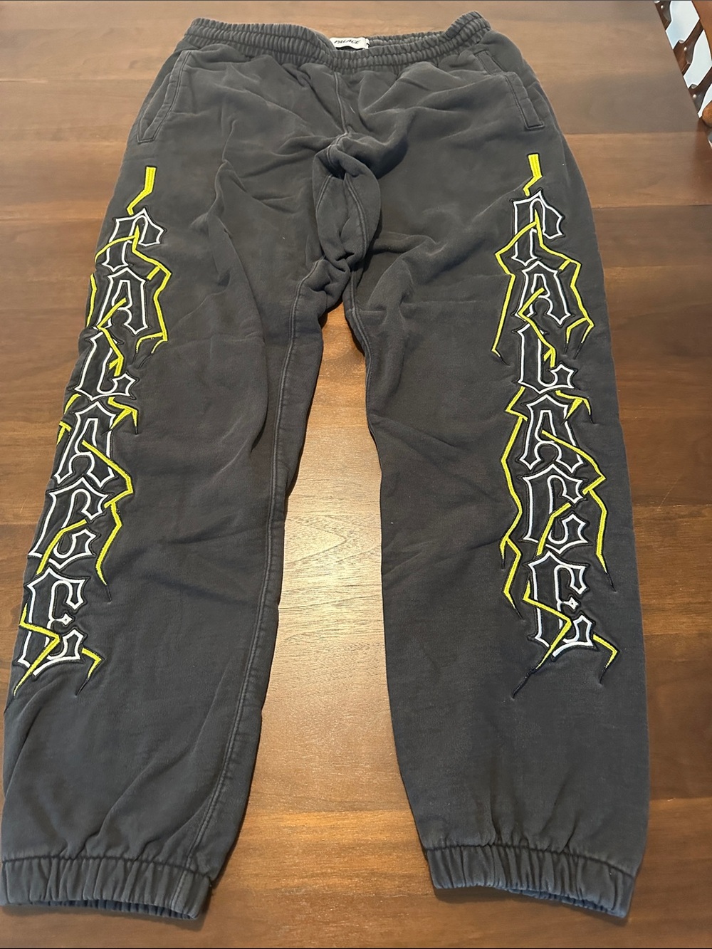 Black Palace Graphic Jogger Sweatpants with Yellow Accent